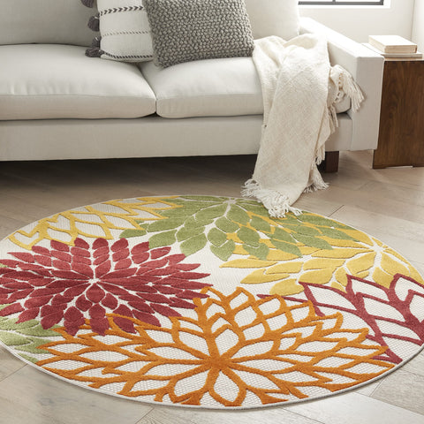 Nourison alfombra frontal empaquetada mostrando diseño tropical y beneficio estético