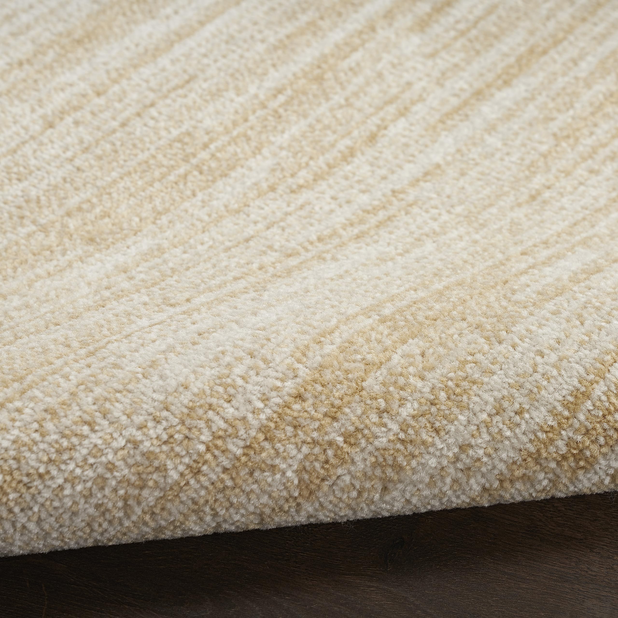 Nourison detalle de tonos ivory y gold que aportan calidez neutra