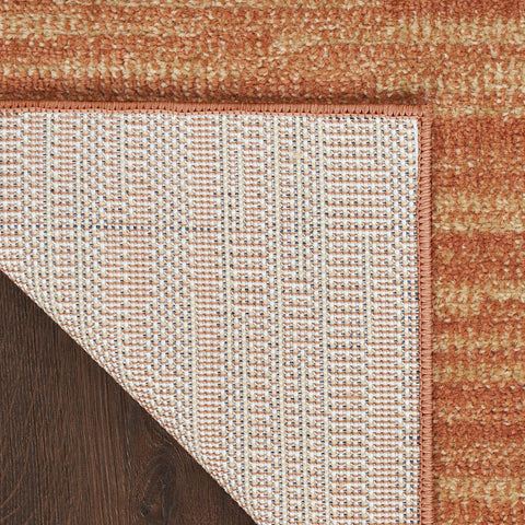Nourison alfombra en porche con sillas, crea ambiente acogedor y resistente