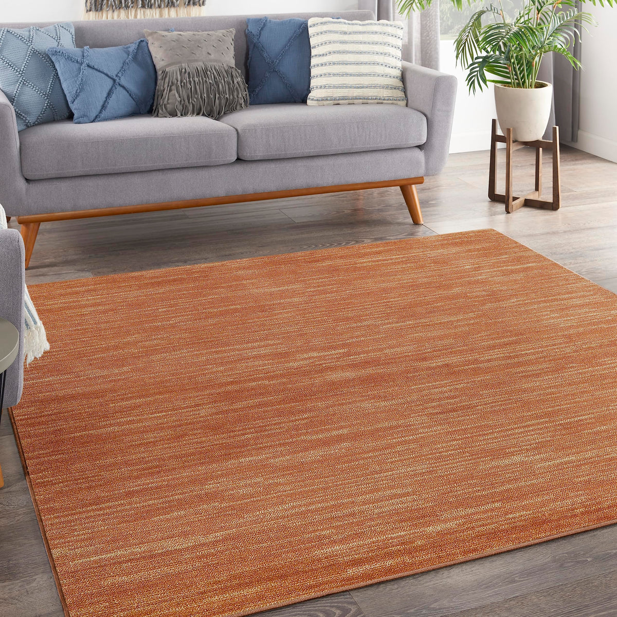 Nourison alfombra frontal mostrando color óxido y borde nítido, aspecto duradero