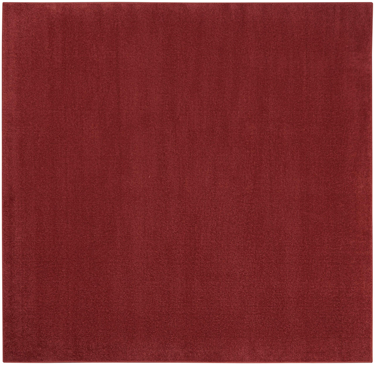 Nourison vista frontal de la alfombra brick red que aporta calidez y resistencia