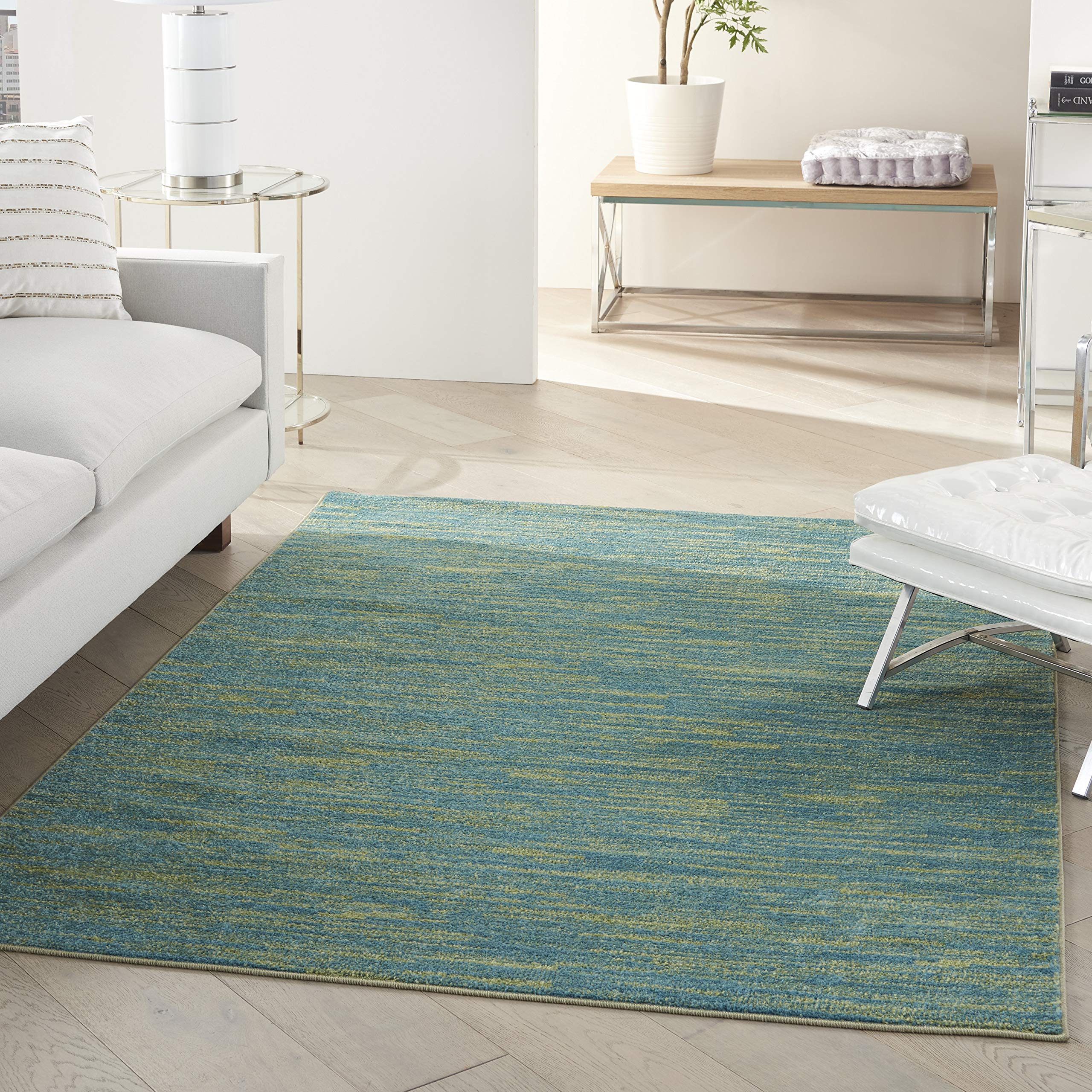 Nourison vista frontal de la alfombra, color azul-verde y estilo versátil