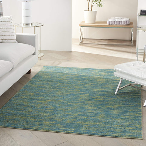 Nourison vista frontal de la alfombra, color azul-verde y estilo versátil