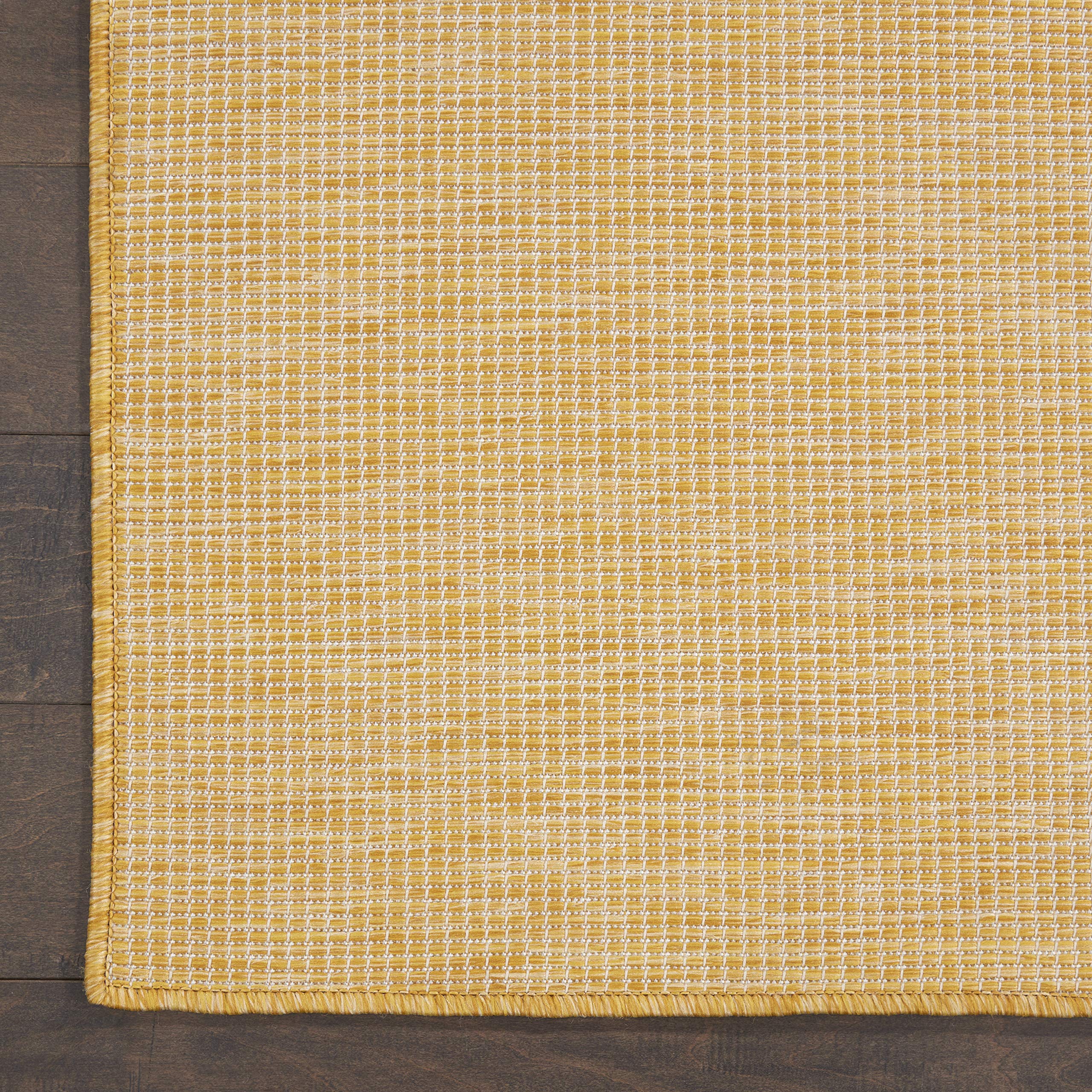 Nourison Positano combinado con otra alfombra, facilita layering decorativo