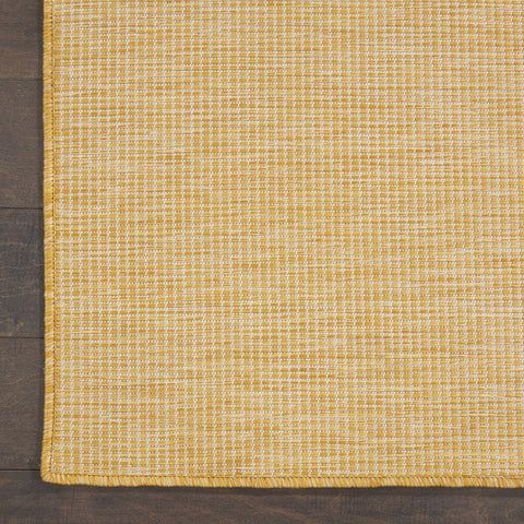Nourison Positano combinado con otra alfombra, facilita layering decorativo