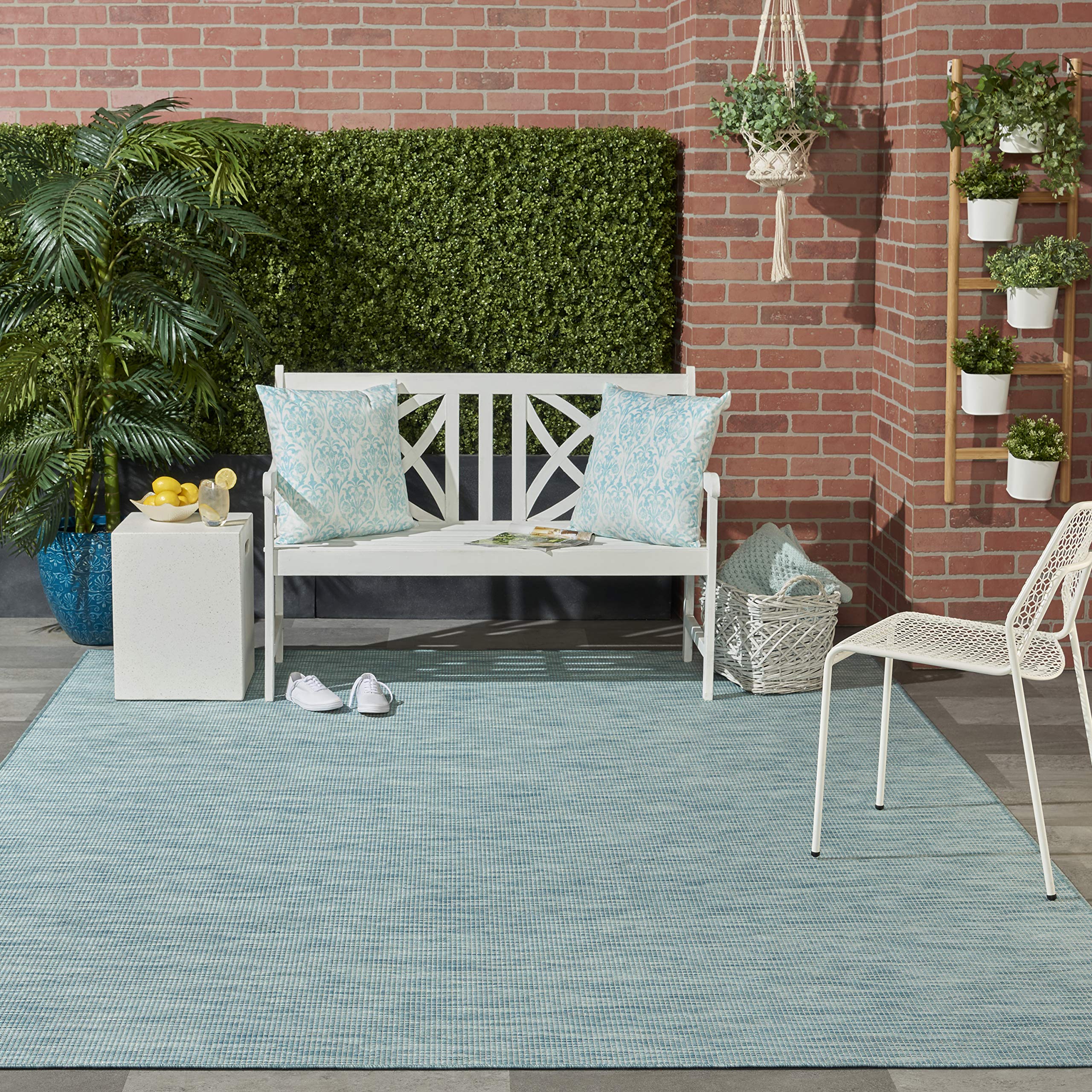 Nourison Positano Aqua detalle de borde y tejido que muestra acabado limpio
