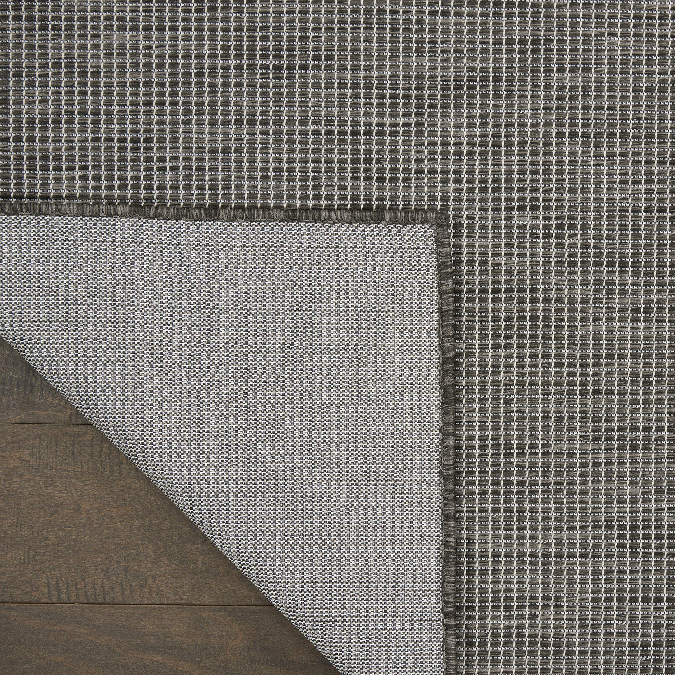 Nourison alfombra bajo mesa de comedor añade estilo y protege suelo