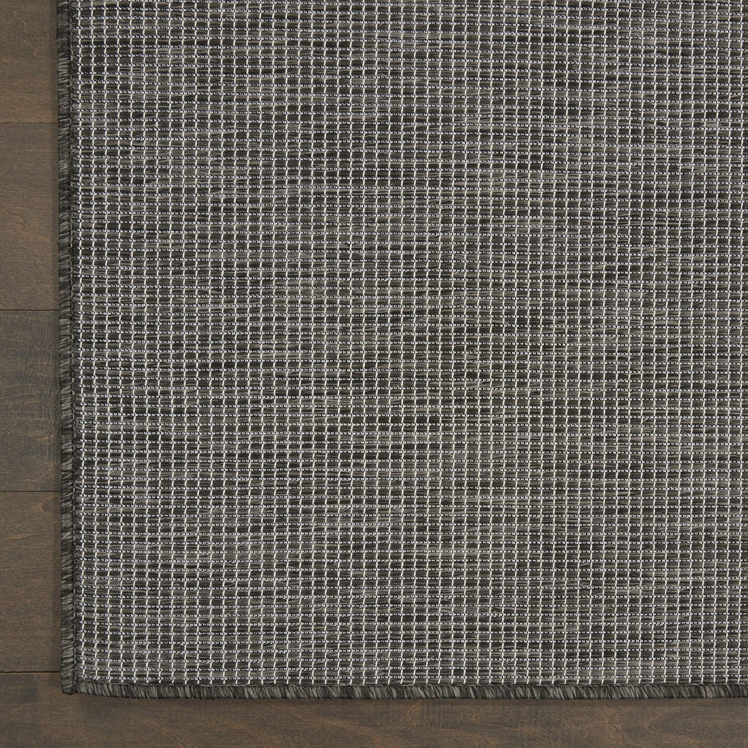 Nourison comparación de tamaño 5' x 7' para ver escala en habitación