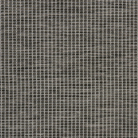 Nourison alfombra junto a una silla para mostrar escala y ajuste