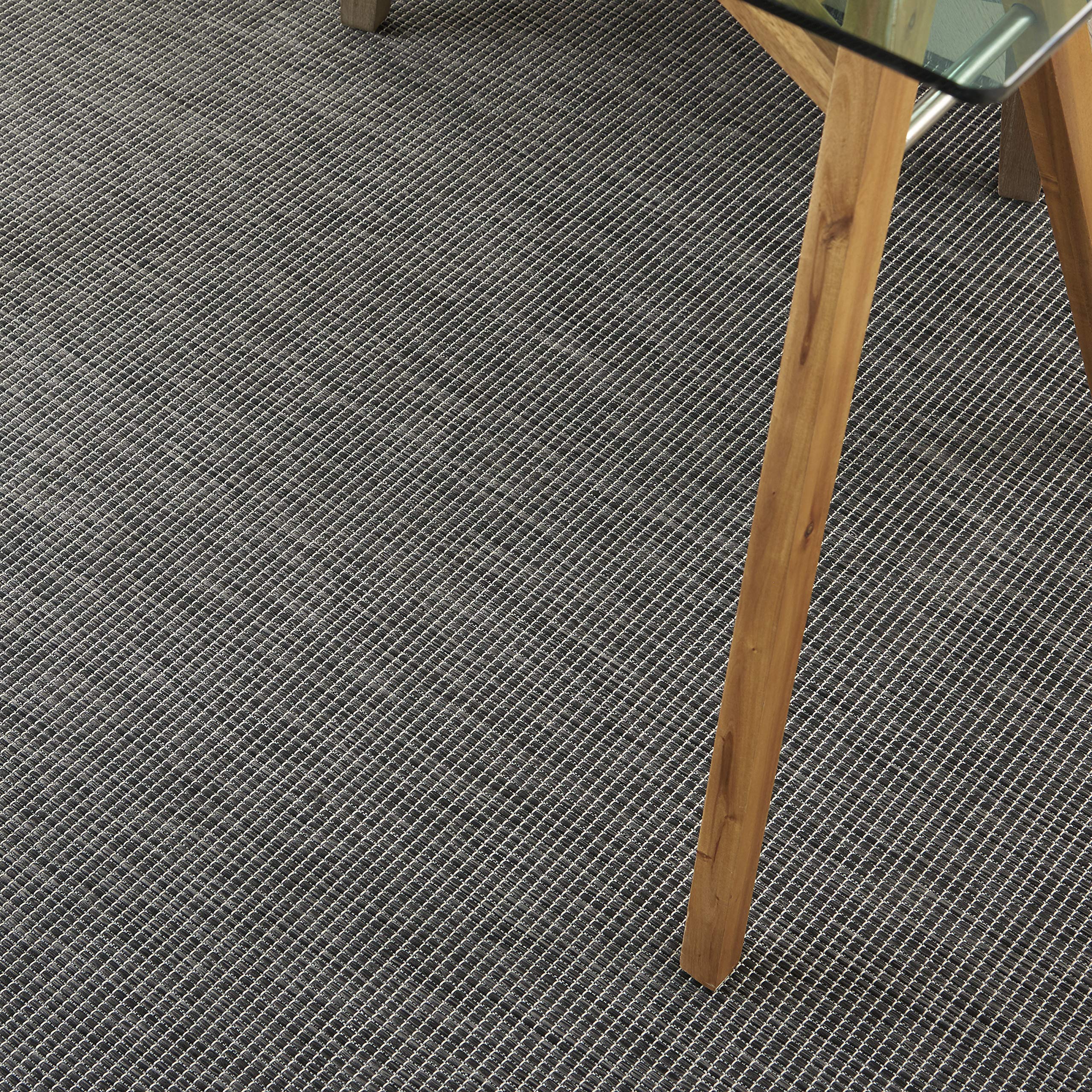 Nourison detalle de textura cerca mostrando durabilidad y apariencia elegante