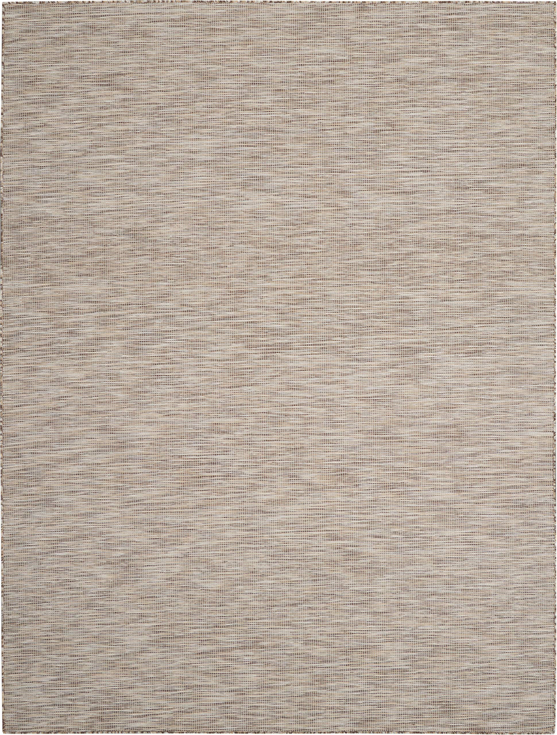 Nourison Positano debajo de una mesa para comparar escala y ajuste de 6'x9'