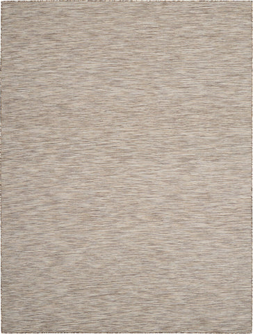 Nourison Positano debajo de una mesa para comparar escala y ajuste de 6'x9'