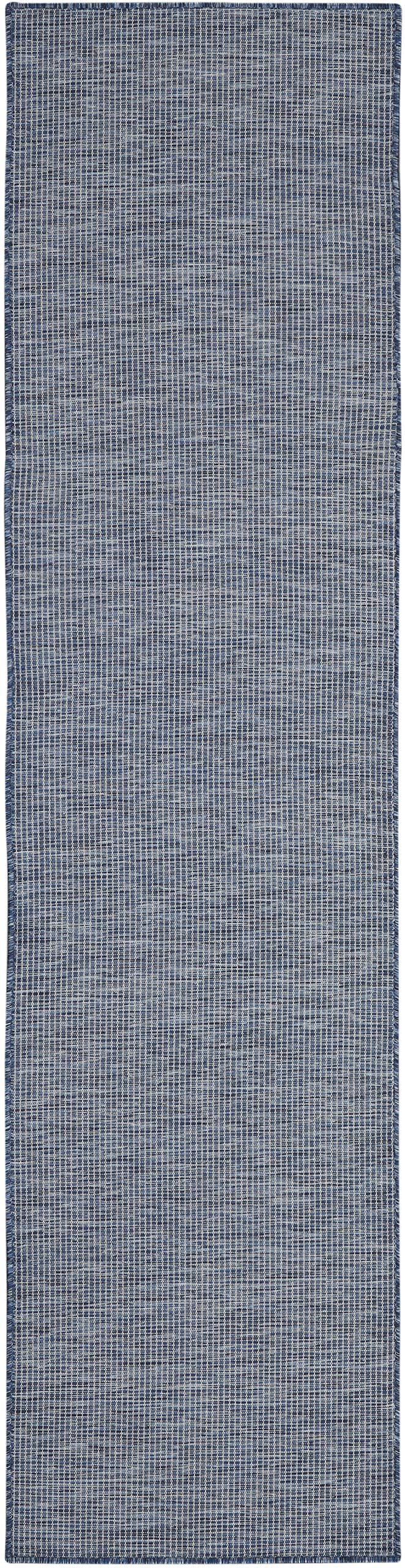 Nourison primer plano de textura space-dyed mostrando durabilidad visible
