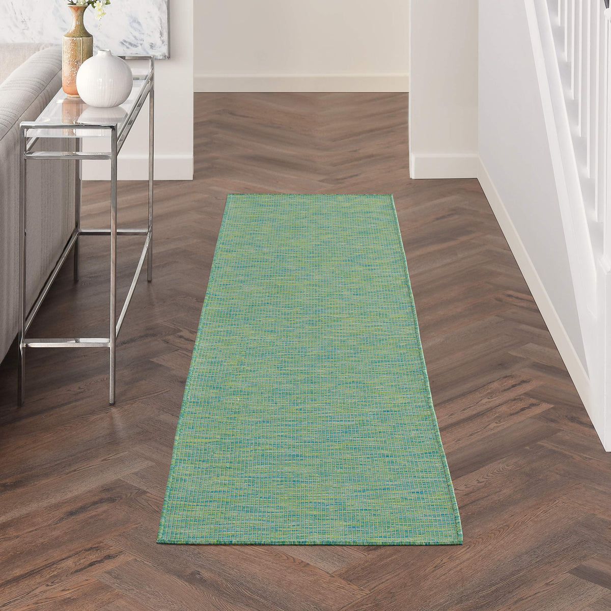 Nourison runner frontal mostrando tonos azul y verde y durabilidad