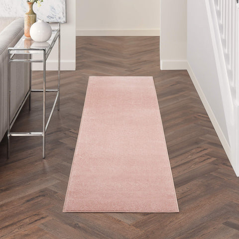 Nourison vista frontal del runner rosa, aporta calidez y diseño
