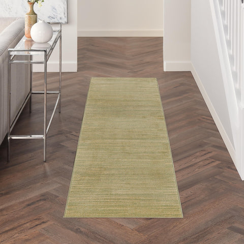 Nourison runner frontal mostrando diseño verde y dorado y beneficio estético
