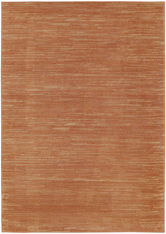 Nourison alfombra rust colocada en patio, ideal para uso exterior y fácil limpieza