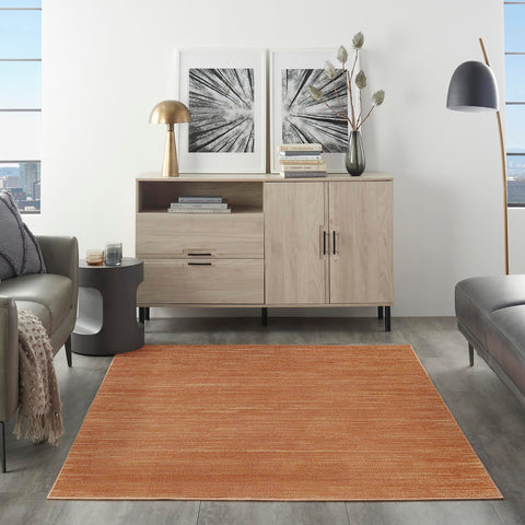 Nourison alfombra rust primer plano de textura, revela tacto suave y durabilidad