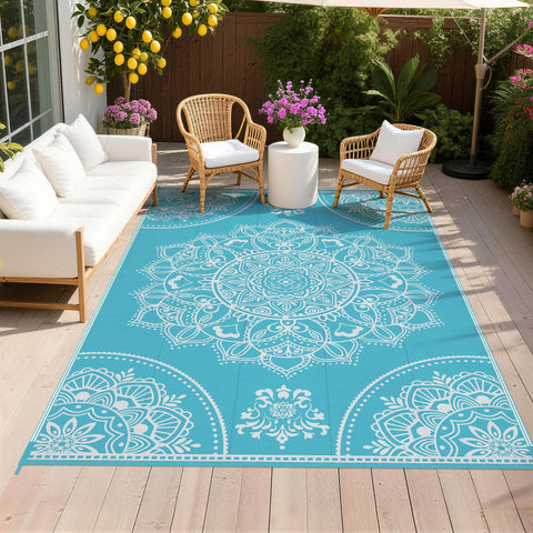 Pauwer alfombra exterior frontal mostrando patrón floral teal y protección contra manchas