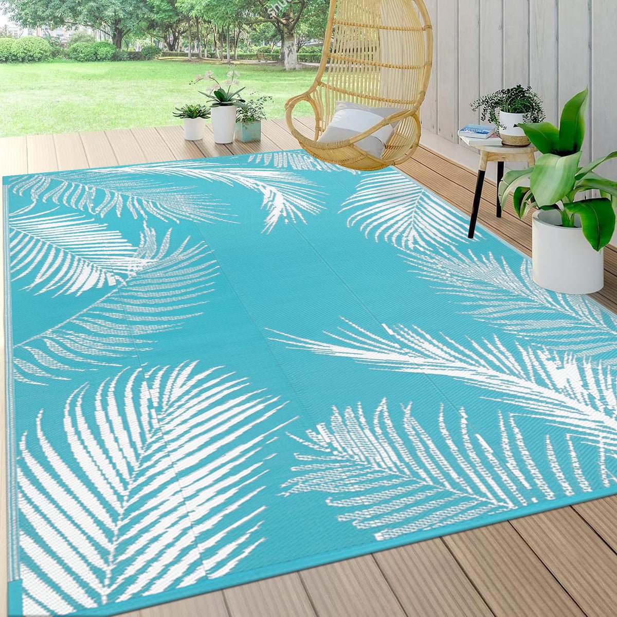 Pauwer alfombra frontal mostrando diseño de hojas teal y protección decorativa
