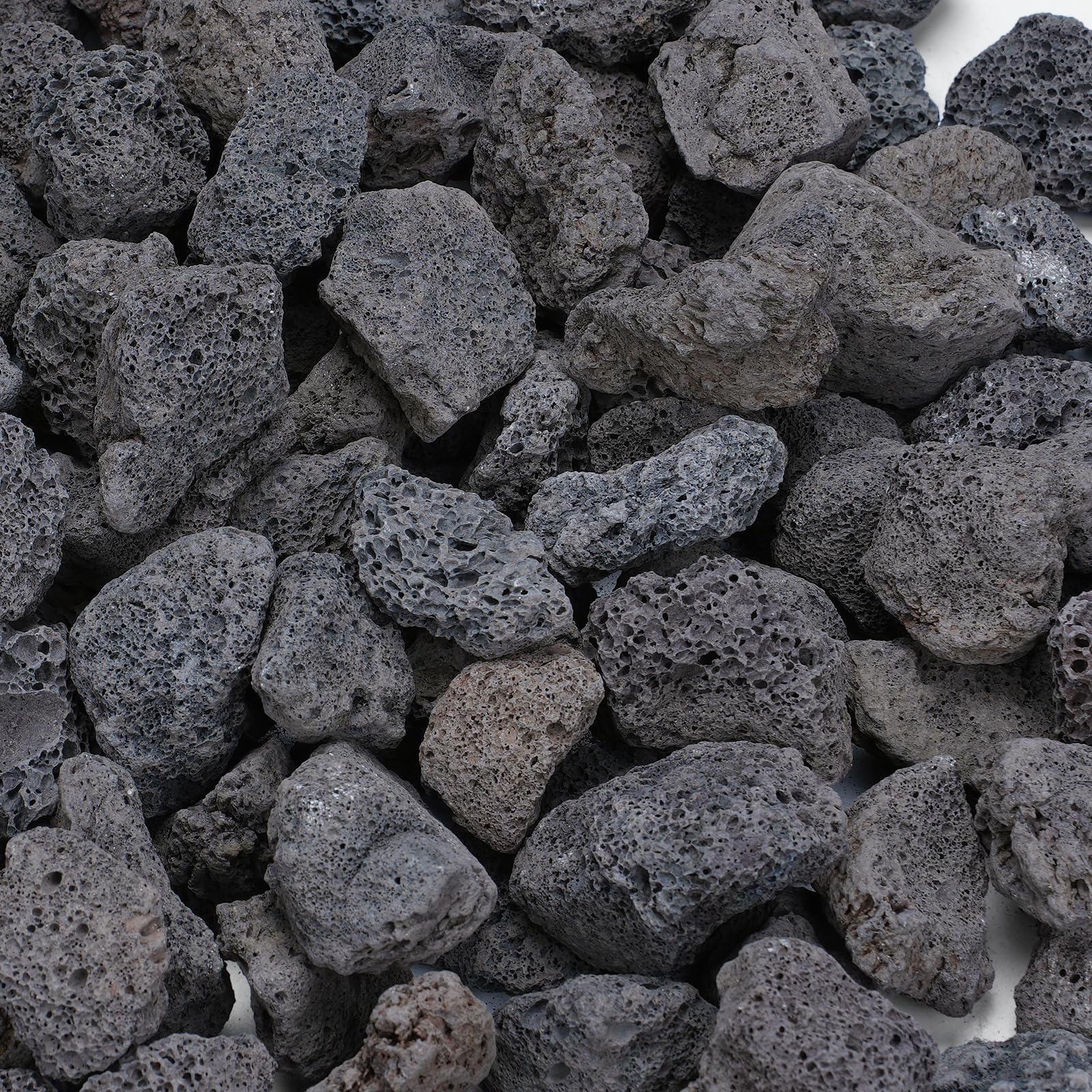 Rahato bolsa frontal 10 lb mostrando piedras volcánicas negras, apariencia profesional