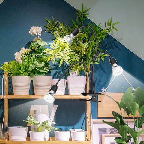 SANSI lámpara iluminando varias plantas en interior para crecimiento suplementario
