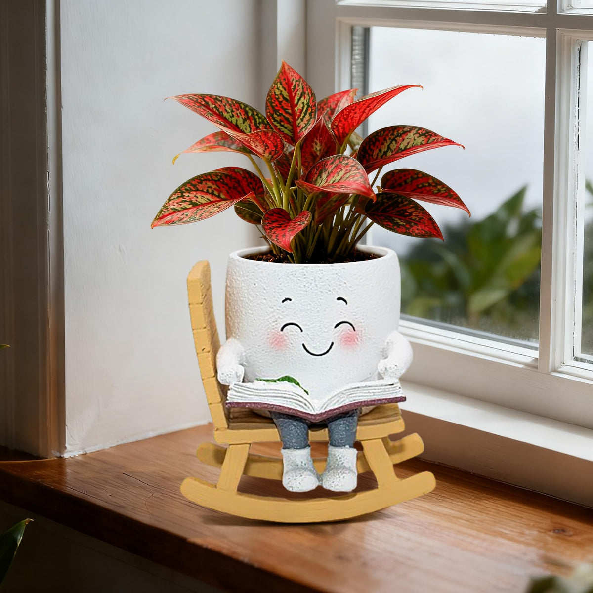 Toparad maceta frontal mostrando diseño silla balancín y sonrisa, aporta encanto