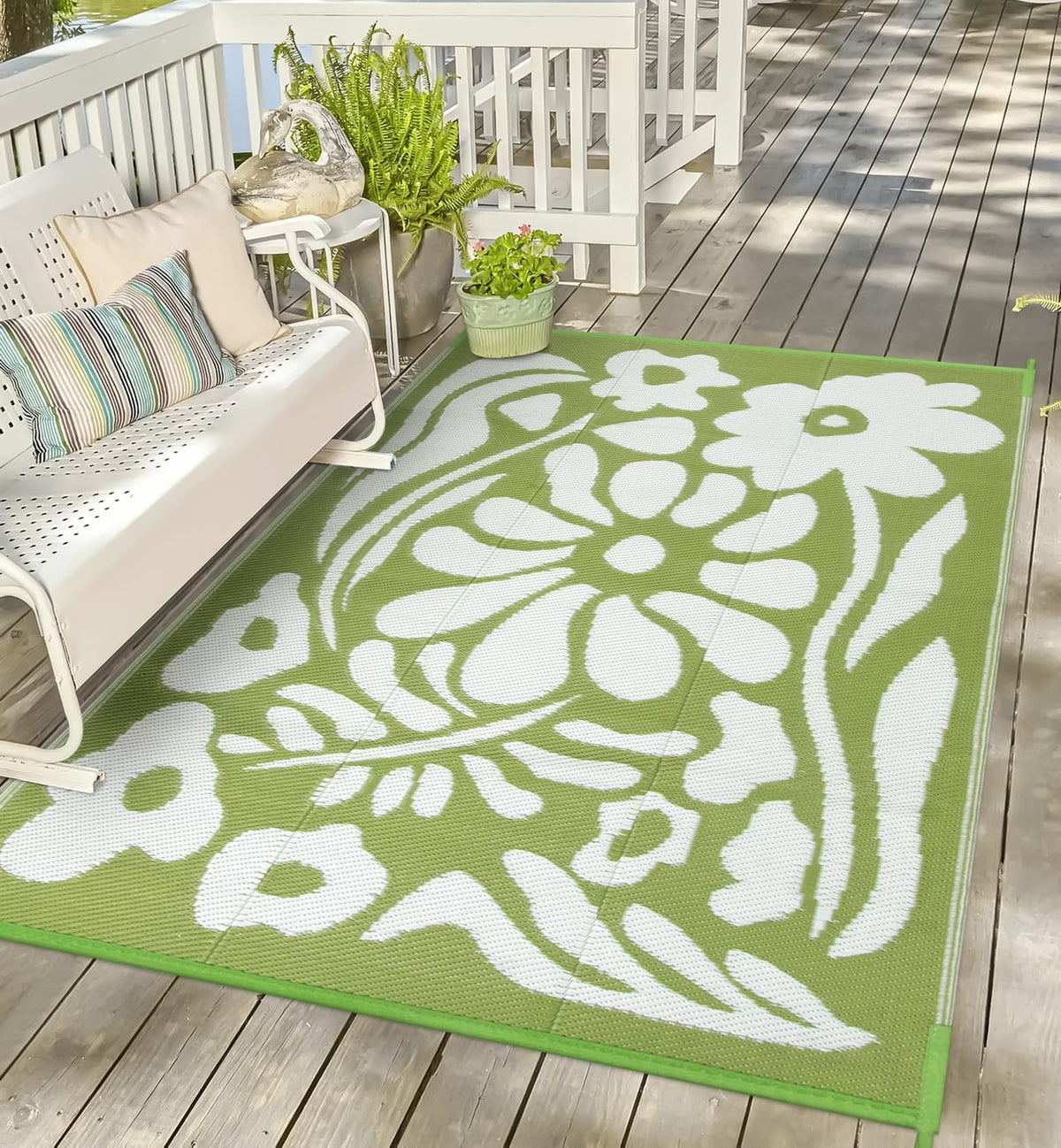 Uphome alfombra exterior frontal mostrando diseño verde floral y resistencia