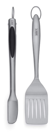Weber juego frontal con espátula y pinzas mostrando diseño elegante y duradero