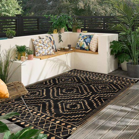 Wonnitar alfombra junto a una regla mostrando el tamaño 6'x9' para referencia